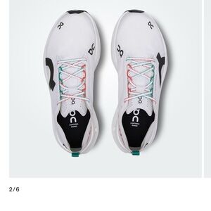 On Running White and Black Athletic Shoes